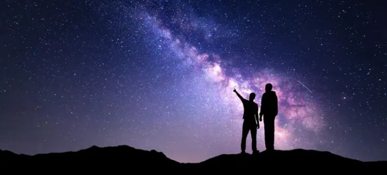 couple stargazing at night