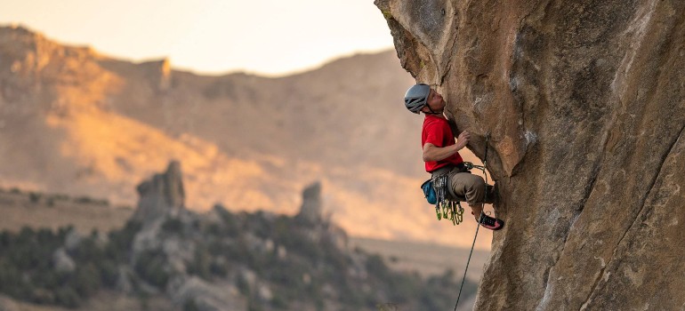 man rock climbing